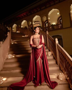 Shereen Sikka Instagram - Not for one second do I take for granted being able to work and create with legends like @taruntahiliani and @kareenakapoorkhan to make magic. I love you both! 
With the best teams ever for @iifa 
@kareenakapoorkhan in @taruntahiliani couture and @birdhichand and @amrapalijewels 
styled with @shereenlovebug 

‘A sublime interplay of deep wine and antique gold, this ensemble is a modern revival of our archival 2008 piece—reimagined for today while retaining its timeless essence. The Bidri-inspired embroidery, enriched with exquisite dabka and nakshi detailing, pays homage to heritage craftsmanship. The ensemble takes the classic sculpted saree corset and amalgamates it with the drape of a fluid textile cape, striking a balance between structure and softness. A true expression of India Modern—where the past is not just remembered but brought to life with contemporary relevance.’ - Tarun Tahiliani 
A Big Thank you to Tarun’s amazing team! 

Photography- @thirddimension
Choker and earrings- @birdhichand
Cuff and ring- @amrapalijewels
Bag- @motifsbysurabhididwania 
My team @stylebyvanshika @niyatiij 
My management @alisha5dave 
beauty @savleenmanchanda @bbhiral