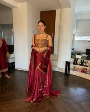 Shereen Sikka Instagram - Not for one second do I take for granted being able to work and create with legends like @taruntahiliani and @kareenakapoorkhan to make magic. I love you both! 
With the best teams ever for @iifa 
@kareenakapoorkhan in @taruntahiliani couture and @birdhichand and @amrapalijewels 
styled with @shereenlovebug 

‘A sublime interplay of deep wine and antique gold, this ensemble is a modern revival of our archival 2008 piece—reimagined for today while retaining its timeless essence. The Bidri-inspired embroidery, enriched with exquisite dabka and nakshi detailing, pays homage to heritage craftsmanship. The ensemble takes the classic sculpted saree corset and amalgamates it with the drape of a fluid textile cape, striking a balance between structure and softness. A true expression of India Modern—where the past is not just remembered but brought to life with contemporary relevance.’ - Tarun Tahiliani 
A Big Thank you to Tarun’s amazing team! 

Photography- @thirddimension
Choker and earrings- @birdhichand
Cuff and ring- @amrapalijewels
Bag- @motifsbysurabhididwania 
My team @stylebyvanshika @niyatiij 
My management @alisha5dave 
beauty @savleenmanchanda @bbhiral