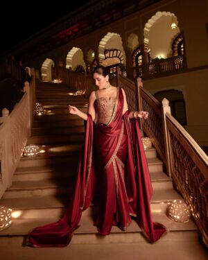 Shereen Sikka Instagram - Not for one second do I take for granted being able to work and create with legends like @taruntahiliani and @kareenakapoorkhan to make magic. I love you both! 
With the best teams ever for @iifa 
@kareenakapoorkhan in @taruntahiliani couture and @birdhichand and @amrapalijewels 
styled with @shereenlovebug 

‘A sublime interplay of deep wine and antique gold, this ensemble is a modern revival of our archival 2008 piece—reimagined for today while retaining its timeless essence. The Bidri-inspired embroidery, enriched with exquisite dabka and nakshi detailing, pays homage to heritage craftsmanship. The ensemble takes the classic sculpted saree corset and amalgamates it with the drape of a fluid textile cape, striking a balance between structure and softness. A true expression of India Modern—where the past is not just remembered but brought to life with contemporary relevance.’ - Tarun Tahiliani 
A Big Thank you to Tarun’s amazing team! 

Photography- @thirddimension
Choker and earrings- @birdhichand
Cuff and ring- @amrapalijewels
Bag- @motifsbysurabhididwania 
My team @stylebyvanshika @niyatiij 
My management @alisha5dave 
beauty @savleenmanchanda @bbhiral