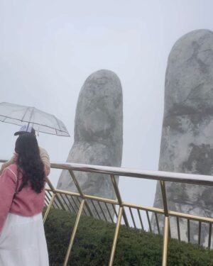 Shubhi Garg Agarwal Instagram - // The mighty Golden Hands Bridge 🌟🌁

The entire Bana Hills were covered in fog and we were freezing!!!! 🥶 As we walked on the bridge, we realised the authorities have removed the glass ramp and have replaced it with wooden flooring for the tourists to walk comfortably.
But I was so excited to see the glass ramp. Bummer! 😔

Nevertheless, we enjoyed our experience as we lived the magical moments at this iconic site. 🤩 
PS : The best time to visit Bana Hills is during the sumner if you want to see the greenery around and the bridge clearly.

There’s so much more at Bana Hills to explore. Taking you through the trip in my next posts. Stay tuned.
.
.
.
.
.
.
.
.
#pickeratpace #indianblogger #indiantravelblogger #vietnam #vietnamtravel #vietnamtrip #banahills #banahillsvietnam #goldenhandsbridge [vietnam bana hills, bana hills vietnam, golden hands bridge vietnam, indian travel influencer, danang vietnam]