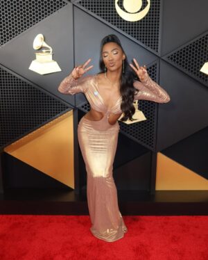 Taylor Hale Instagram - HELLO AGAIN, GRAMMYs!

I’m still short circuiting but just imagine this being a big long caption about how dreams come true when you don’t give up on yourself. 

I’ve had @waltercollection gowns saved in my favorites folder for YEARS and now he dressed me for my dream job? HELLO? Can we talk about the back?!

My phone’s on DND. I’m on cloud 9. More to come ✨