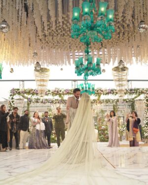 Zara Noor Abbas Instagram - Ufhhh This day was more than just a wedding - it was a celebration of love, family, and resilience. Despite the rain’s best efforts to dampen our spirits, we persevered and made this day unforgettable. 
Somethings I’ll never forget - running in and out of halls in the coldest day of Lahore, having rain washing away the decor and food stalls - watching my little brother become a husband and making sure his lady love was okay. The rain may have tried to ruin our perfect plans, but it only made this day more memorable. I’m so so grateful for the love and support of our family and friends who made this day so special. It would have been NOTHING without you all. My Event managers @zawaajevents and my @the_videographers Were the stars of the show. How they managed to capture everything and my Event person who made sure everything looked stunning even after the chaos. THANK YOU SO MUCH. Also a huge shout out to @ayesha.shoaib.malik for making my beautiful dress and giving me the perfect fit for my brothers walima. 

Apki shaaadi hogayeeee Amuuuu bhai, and Congratulations -  @ahmadabbasgill on finding your soulmate and @ssameen._ Welcome to the Family 🎉🥲 🫂🥲🧿🤍🪄