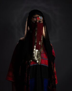 Zhalay Sarhadi Instagram - Palestinian Thobe 🍉

Amani Geha wears a 65-year-old traditional widow’s thobe from Beersheba, passed down through generations as a family heirloom. Rich in history, this handmade garment reflects the Bedouin style of the region, showcasing vibrant motifs and intricate embroidery that are more than just beautiful—they are storytellers. Each stitch carries deep meaning, with symbols like the geometric designs signifying fertility.

Palestinian thobes have long marked social status and identity. Each region has its own unique patterns. These garments, carefully crafted by hand over months, were made for life’s major events—weddings, mourning, and daily wear.

Today, the thobe is a symbol of cultural resistance and pride, worn at protests and global events to assert Palestinian identity. This photograph celebrates that resilience and the vital role of preserving these timeless traditions for future generations.

تَرتدي أماني جحا ثوبًا فلسطينياً تقليديًا من مدينة بئر السبع عمره فوق ال 65 عامًا، وقد تم توريثه عبر الأجيال كإرث عائلي. هذا الثوب اليدوي غني بالتاريخ ويعكس أسلوب البدو في المنطقة، حيث تظهر الزخارف النابضة بالحياة والتطريز الدقيق الذي ليس فقط جميلاً، بل يروي قصصًا. كل غرزة تحمل معنى عميقًا، فمثلاً ترمز التصاميم الهندسية الخصوبة. لطالما كان الثوب الفلسطيني علامة على المكانة الاجتماعية والهوية. ولكل منطقة في فلسطين أنماطها الفريدة. هذه الأثواب، التي يتم صنعها بعناية يدويًا على مدار شهور، صُنعت لتناسب المناسبات المهمة في الحياة، مثل حفلات الزفاف، والحداد، واللباس اليومي.

اليوم، يمثل الثوب رمزًا للمقاومة الثقافية والفخر، حيث يُرتدى في المظاهرات والمناسبات العالمية للتأكيد على الهوية الفلسطينية. تحتفي هذه الصورة بتلك القوة والصمود، والدور الهام في الحفاظ على هذه التقاليد الخالدة للأجيال القادمة.

Project credit:
Lead cast: @amaniegeha 
Director, Writer, Producer, DOP, Gaffer, Editor, Sound, Colorist: @moamenghanim 
Thoub generously provided by @feda_allouh 
Stylist: @ayatallax 
Makeup artist: @makeupbymaab 
Production assistant, BTS videographer: @janaislam___ 
1st AD, BTS videographer: @murielletannous 
Special thanks for @tasweer.qa @dohafirestation @almayassabnthamad @qatar_museums for facilitating the filming location
Source: @aljazeera