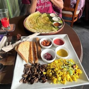 Aishwarya Raghu Instagram - Why does my brother click such shitty photos of me? 😐
Anyhoo, this post is about the amazing plant based food we had in auroville (highly highly recommended)

Here's a list of Restaurants and what we ordered:
1) Sprout (cherry 🍅 tart, tofu-barley teriyaki bowl)
2) Marc's cafe (vegan cheese pesto dosa)
3) Coffee Break (vegan tofu pesto sandwich, berry smoothie in coconut milk)
4) Auroville bakery (Falafel bowl)
5) Marc's cafe (classic big ben with Plant based sausage, scrambled tofu and mushrooms)
6) Sakura sushi - Avacado, mushroom maki, vegan nigiri and rice rolls
7) Gelato Factory - vegan stracciatella flavour 😋😋

#grateful #unfiltered #krishandaish #plantbased