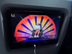 Anne Burrell Instagram - Ok… so this is a first… watching myself last night on #houseofknives while on a flight to Vegas!!! I was eating airplane snacks, knitting and watching like a crazy lady!! I think I look pretty good up there on the throne!!! Thank you to Nikol the lovely flight attendant who took the photo. 😊#ilovewhatido #luckygirl