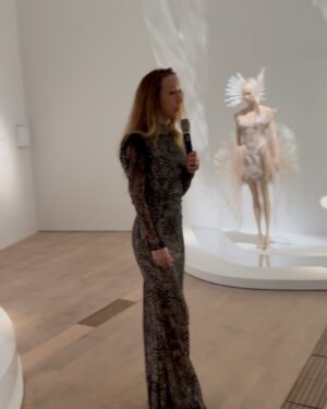 Fiona Xie Instagram - The Alchemy of @irisvanherpen @voguesingapore 

“I find beauty in the continual shaping of chaos which embodies the primordial power of nature’s performance,” Iris van Herpen once said—words that illuminated my understanding of her work at the nexus of ancient alchemy and @cern physics.

Her liminality is her genius. “I see technology as a tool to express the handwork better,” she explains, dissolving false binaries. When her kinetic structures breathe with the wearer, we witness her core philosophy: “Movement is my constant inspiration. Our human body is in continuous motion, as is everything around us.”

These undulating architectures manifest what philosopher Merleau-Ponty called “the flesh of the world”—the profound interconnectedness between perceiver and perceived. Her approach transforms rigid materials into liquid motion, embodying Bachelard’s insight that “matter is the unconsciousness of form.”

I remember showing my friend @grimes in that “Dune of Souls” creation at the met gala whispering “It would be a dream to wear these.” Then @voguesingapore @nat_tasha ‘s call came—Iris would dress me for the @artsciencemuseumsg retrospective. I swooned like a teenager locked lips in her first kiss. Manifestation is real. 

“Fashion is an expression of the zeitgeist, while couture is an expression of eternal beauty.” These words resonated as I stood transfixed clad in her “Architectonics” collection—embodying what Rilke meant by “living the questions” about our relationship with technology, philosophy, architecture, music, nature, and our bodies.

Draped in her vision, I understood: Iris van Herpen doesn’t design clothing. She designs portals to possibility itself.​​​​​​​​​​​​​​​​

Be transcended at @artsciencemuseumsg 
#IrisVanHerpen #ArtAndFashion #Metamorphosis​​​​​​​​​​​​​​​​ #Vogue