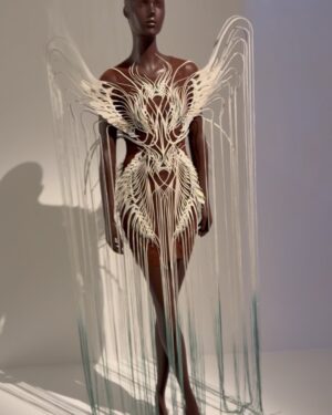 Fiona Xie Instagram - The Alchemy of @irisvanherpen @voguesingapore 

“I find beauty in the continual shaping of chaos which embodies the primordial power of nature’s performance,” Iris van Herpen once said—words that illuminated my understanding of her work at the nexus of ancient alchemy and @cern physics.

Her liminality is her genius. “I see technology as a tool to express the handwork better,” she explains, dissolving false binaries. When her kinetic structures breathe with the wearer, we witness her core philosophy: “Movement is my constant inspiration. Our human body is in continuous motion, as is everything around us.”

These undulating architectures manifest what philosopher Merleau-Ponty called “the flesh of the world”—the profound interconnectedness between perceiver and perceived. Her approach transforms rigid materials into liquid motion, embodying Bachelard’s insight that “matter is the unconsciousness of form.”

I remember showing my friend @grimes in that “Dune of Souls” creation at the met gala whispering “It would be a dream to wear these.” Then @voguesingapore @nat_tasha ‘s call came—Iris would dress me for the @artsciencemuseumsg retrospective. I swooned like a teenager locked lips in her first kiss. Manifestation is real. 

“Fashion is an expression of the zeitgeist, while couture is an expression of eternal beauty.” These words resonated as I stood transfixed clad in her “Architectonics” collection—embodying what Rilke meant by “living the questions” about our relationship with technology, philosophy, architecture, music, nature, and our bodies.

Draped in her vision, I understood: Iris van Herpen doesn’t design clothing. She designs portals to possibility itself.​​​​​​​​​​​​​​​​

Be transcended at @artsciencemuseumsg 
#IrisVanHerpen #ArtAndFashion #Metamorphosis​​​​​​​​​​​​​​​​ #Vogue