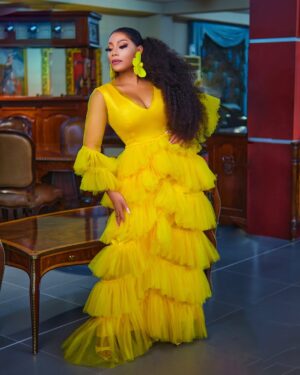 Zynnell Zuh Instagram - Golden blooms and vibrant dreams. Drifting in elegance, one flowy step at a time. Cheers to new beginnings this April! #Zyellegant #LuxuryFashion #BoldAndBeautiful” 

Dress @zyellegant 
Shot by @cassidy_films