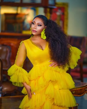 Zynnell Zuh Instagram - Golden blooms and vibrant dreams. Drifting in elegance, one flowy step at a time. Cheers to new beginnings this April! #Zyellegant #LuxuryFashion #BoldAndBeautiful” 

Dress @zyellegant 
Shot by @cassidy_films